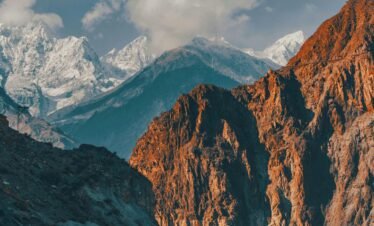 Scenic view of a mountain road with a truck in the Karakoram Range, Pakistan.